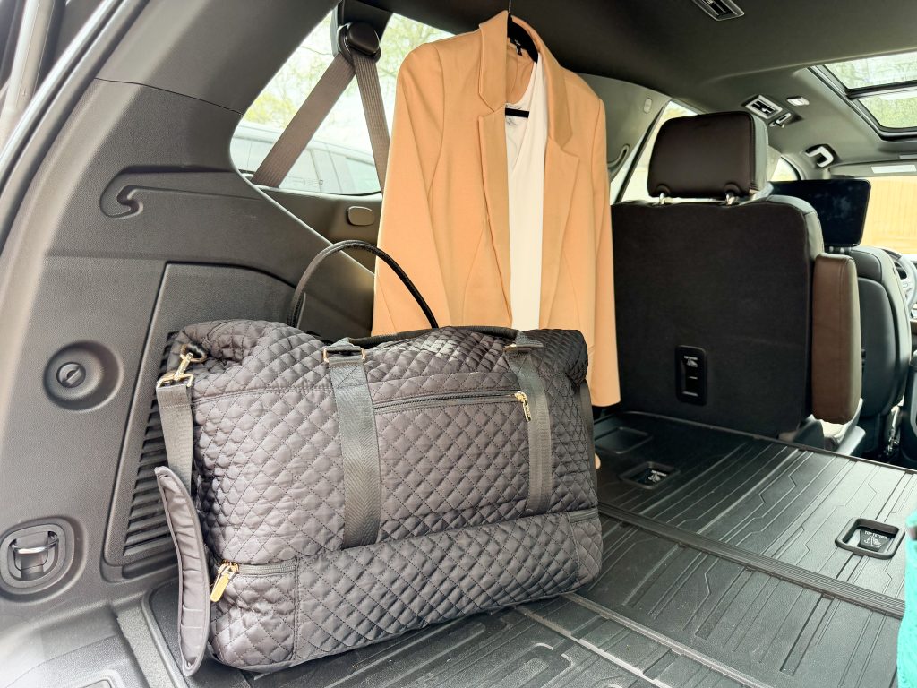 weekender bag packed in the car for a weekend trip